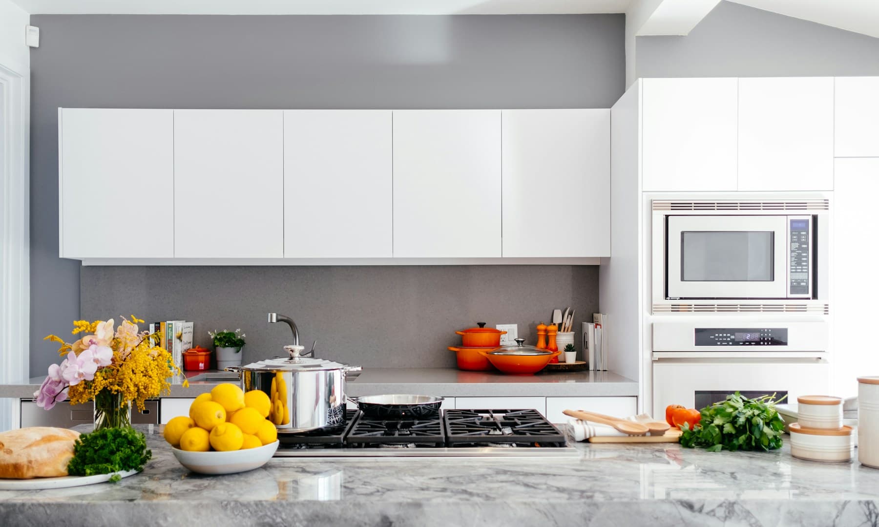 Mediterranean kitchen — Open shelving, zellige tile mood, and sculptural wood
